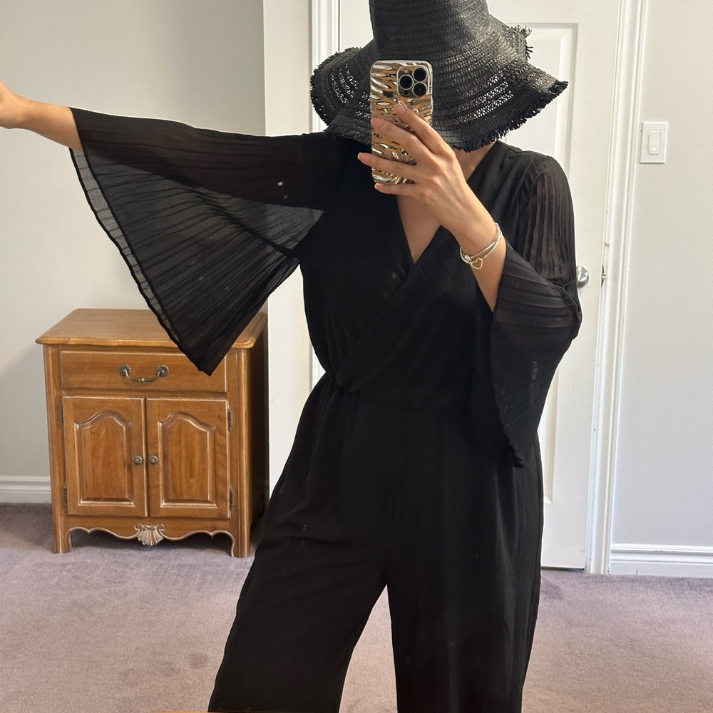 Elegant Luxology Black Wide-Leg Jumpsuit with Pleated Sheer Sleeves – Size XL